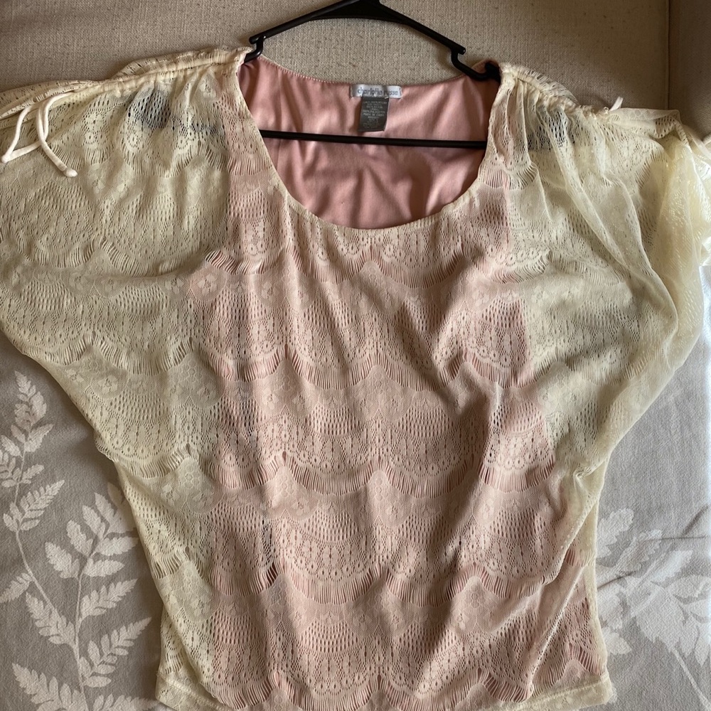 Cream blouse with pale pink under